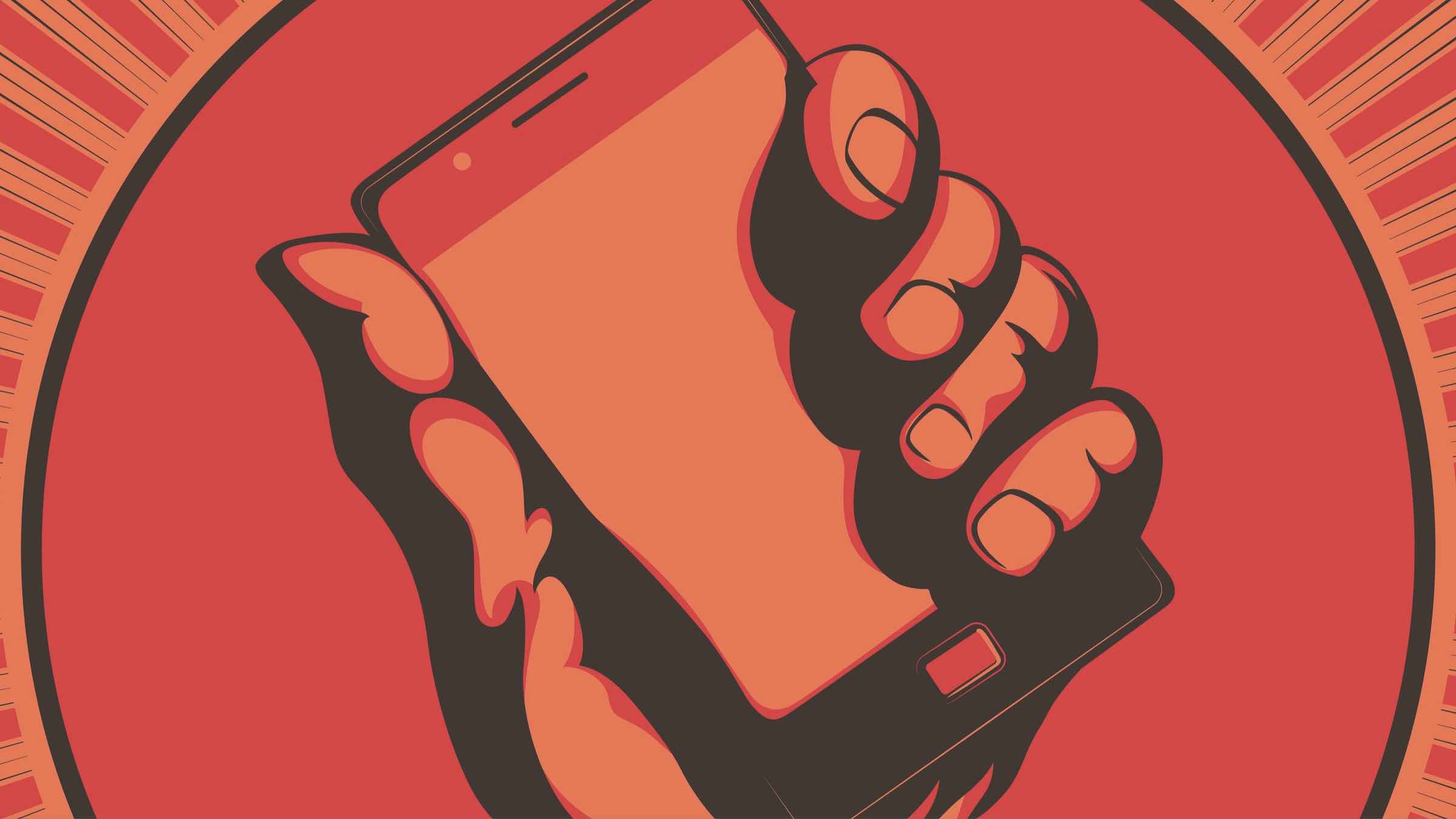 Smartphone en un puño cerrado